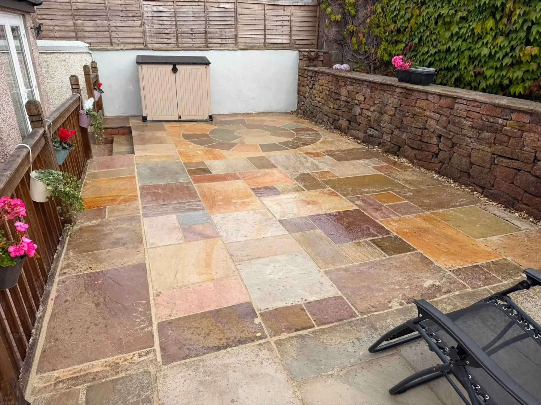 Finished natural-stone patio by D.K Fencing & Paving
